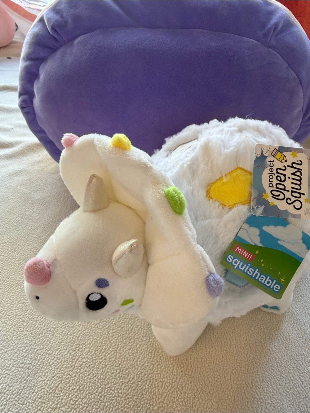 Squishmallows White Dino Mini Plush with Pastel Pom Accents and Gold Horn
